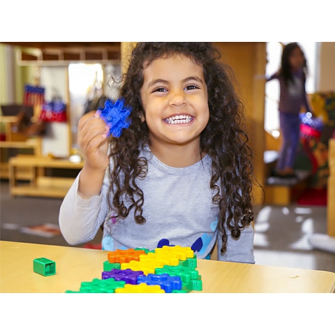 Child playing with manipulatives