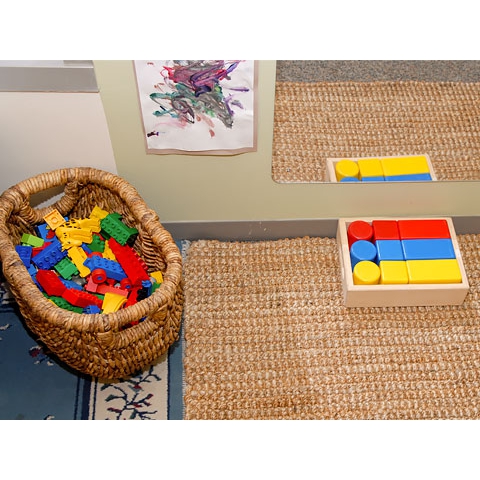 Colored blocks and Legos in basket and wood box