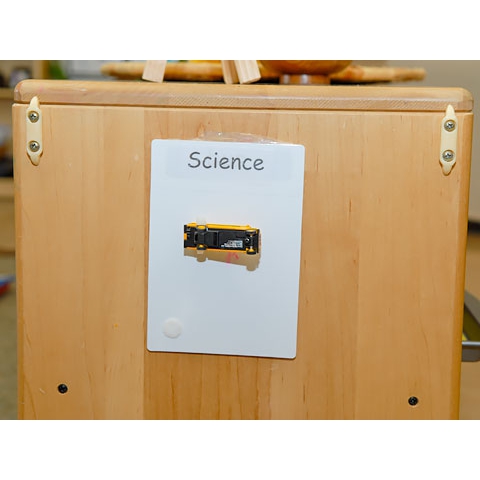 Sign that reads Science, with representative object and written text near science area